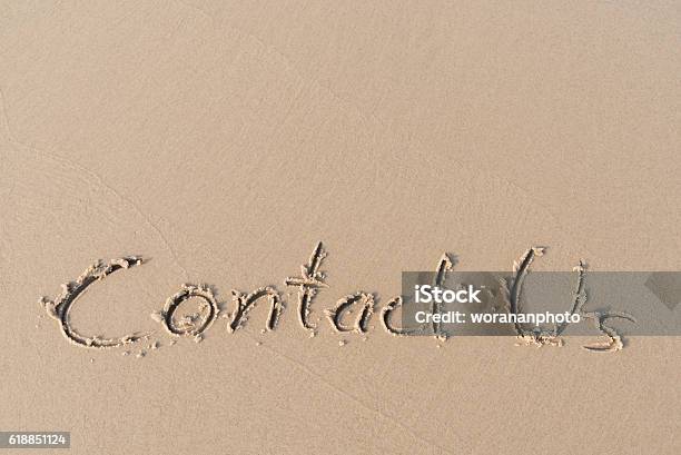 Contact Us Message Written On Sand Beach Stock Photo - Download Image Now - Contact Us, Beach, Outdoors