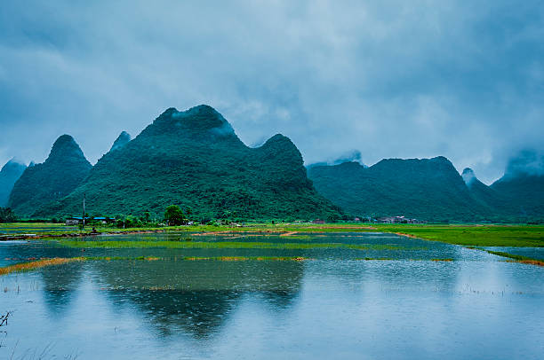 istock Karst mountains and rural scenery in the mist 618851192