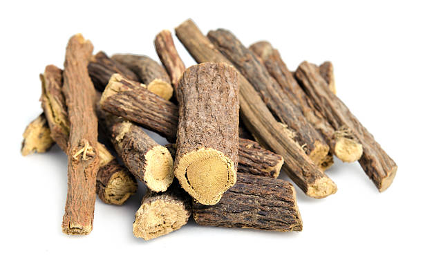 istock Licorice or liquorice root sticks isolated on white background 618851584