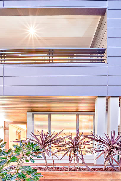 istock Fancy garden with modern mansion lights close up 618854372