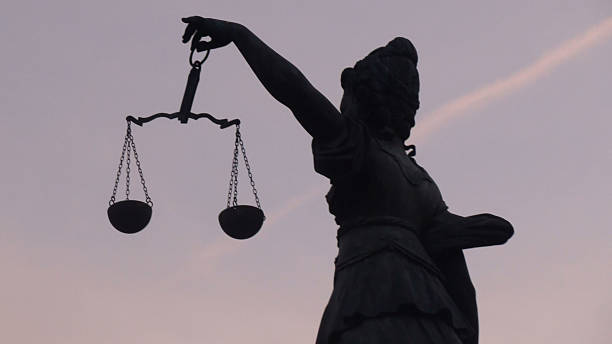 istock Left Side Hand Of Lady Justice Holding Weight Scale 618855206