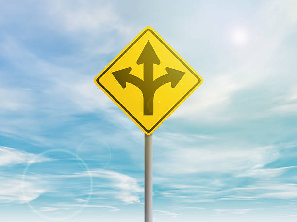 istock Yellow street sign with direction arrows 618856318
