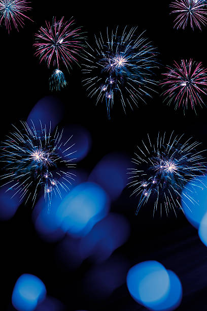 istock Fireworks and defocused lights on a black background 618859266