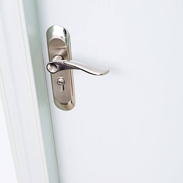 istock Close-up of white door with handle 618860024