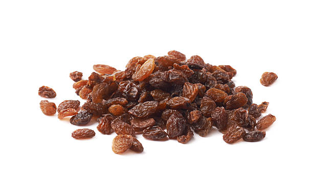 istock Pile of multiple raisins isolated 618861432