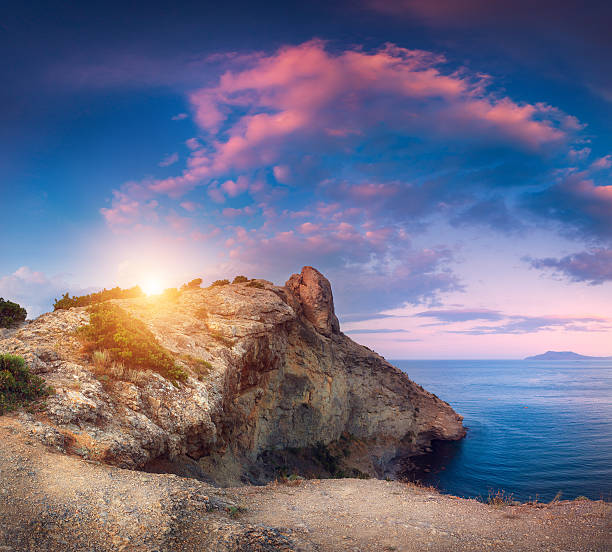 istock Beautiful panoramic landscape with mountains, sea at sunset 618863718