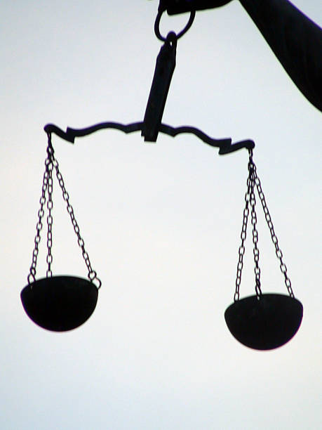 istock Hand Of Lady Justice Holding Weight Scale,Sky View 618865880