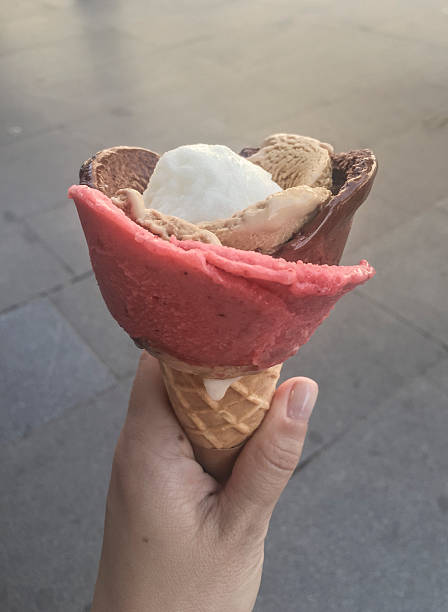 istock female hand holding ice cream on cone 618867976