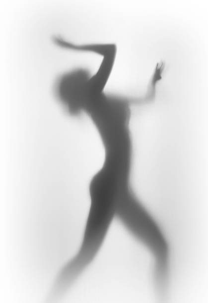 istock Diffuse silhouette of a beautiful and sexy dancer woman 618872664