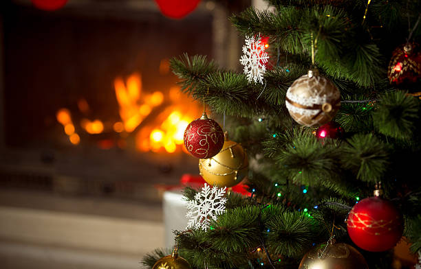istock Holiday background with burning fireplace and decorated Christma 618872996