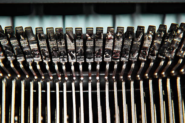 istock Close up of the letters on an old typewriter. 618874280