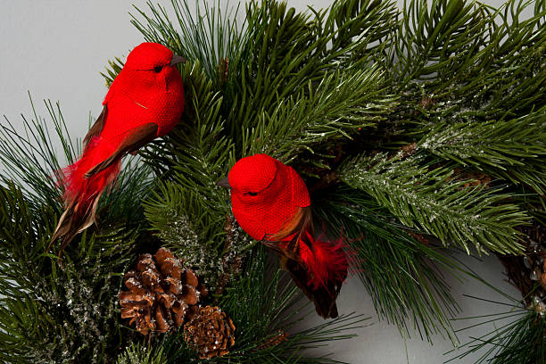 istock detail Christmas wreath with red birds 618874726