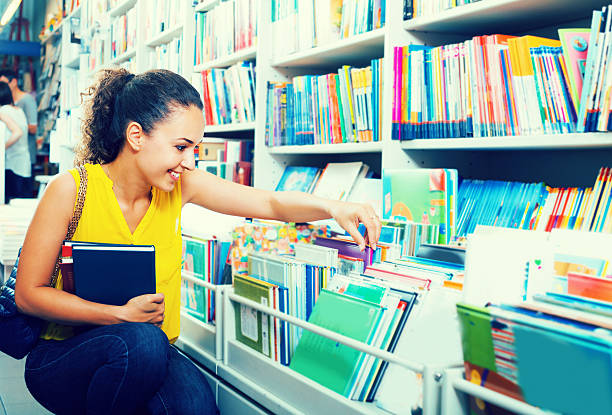 istock young woman in book shop 618874872