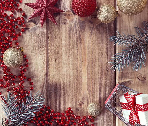 istock Frame with Christmas balls, gift and shopping basket 618937500
