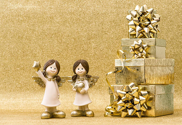 istock Holidays decoration. Christmas Background. Gift box angels 618937804