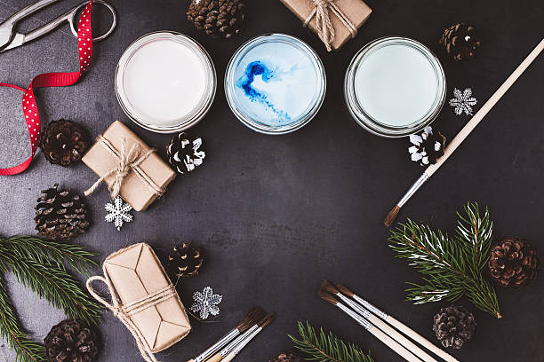 istock Frame of paints and brushes on blue table 618938864