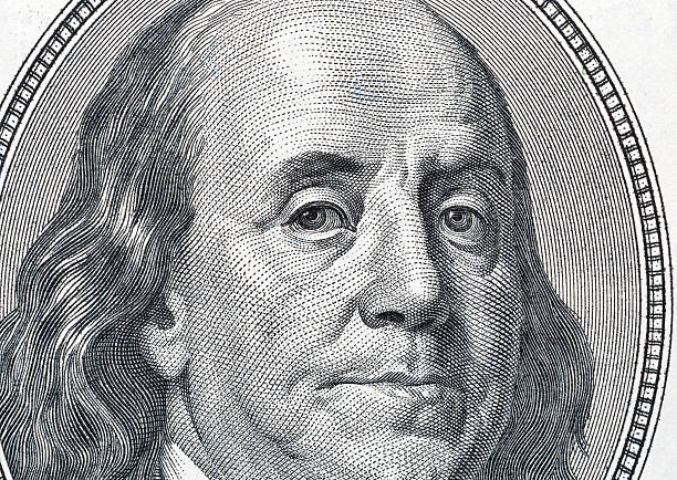 istock Benjamin Franklin portrait on one hundred dollar bill closeup 618940588