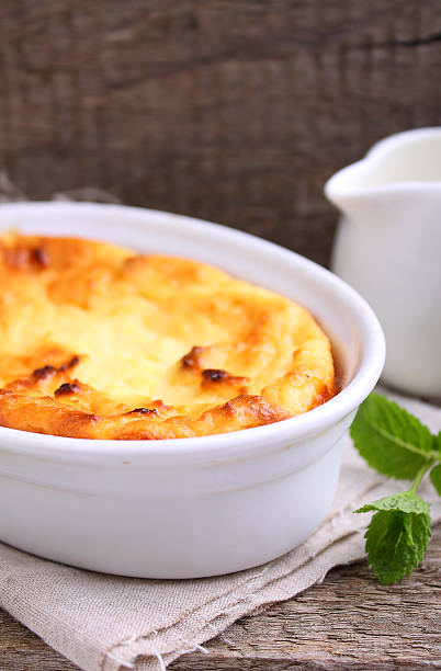 istock Cottage cheese casserole in white dish, on a blue background 618941732