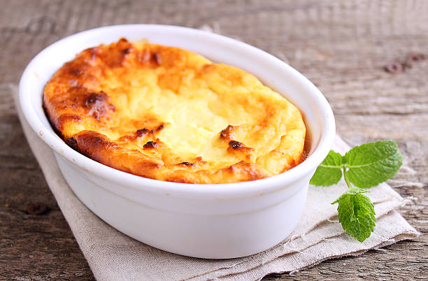 istock Cottage cheese casserole in white dish, on a blue background 618941838