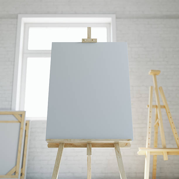 istock Wooden easel with blank white canvas in loft interior of 618942038