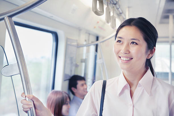istock Young woman riding public transportation 618942194