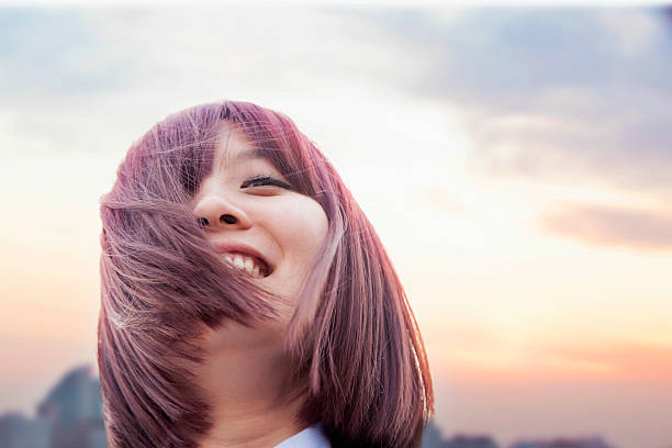 istock Hair blowing in young woman's face 618942318