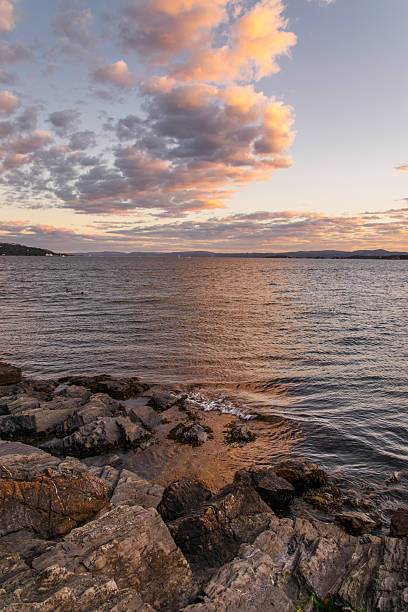 Fluffy clouds over the Oslo bay 1 stock photo