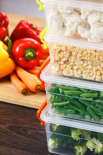 istock Trays with raw vegetables for freezing. 618943156