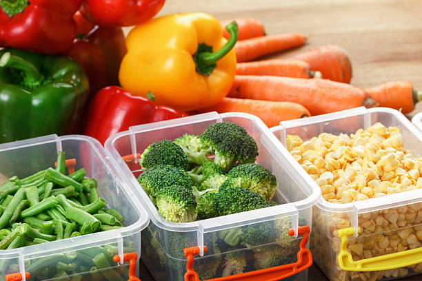 istock Trays with raw vegetables for freezing. 618943212