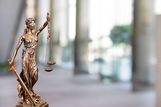 istock Statue Of Lady Justice In An Office 618943716