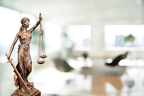 istock Statue Of Lady Justice In An Office 618943740
