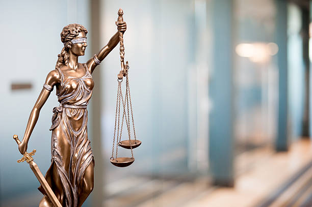 istock Statue Of Lady Justice In An Office 618943758