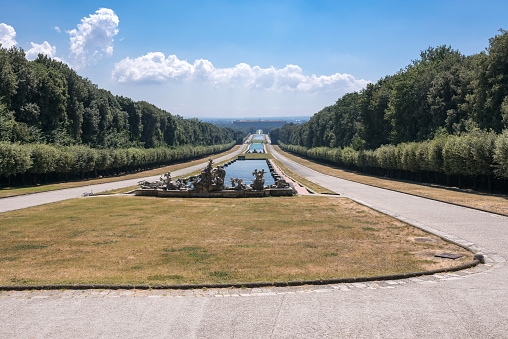 View of long promenade in the park at Royal Palace of Caserta, Italy