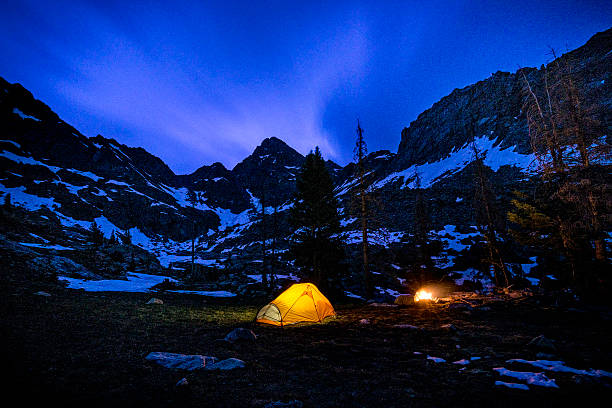 istock Glowing Tent Backpacking Under the Stars at Night 618947088