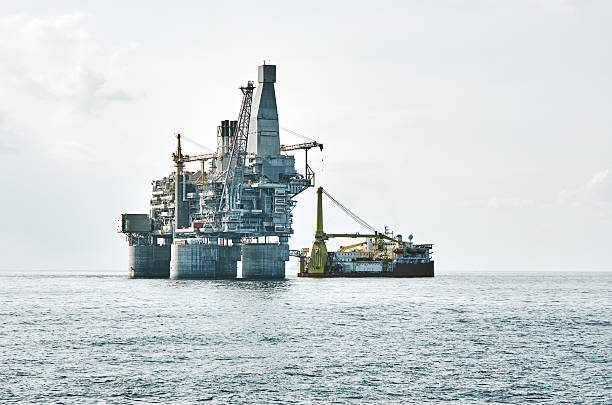 istock Oil rig and support vessel on offshore area 618948596