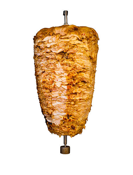 Isolated Middle East Grilled Chicken Kebab Meat Grilled skewered chicken on spit, a traditional meat shaved, served inside kebab sandwich in Mediterranean and Arab countries in Middle East, cooked isolated on pure white background shawarma stock pictures, royalty-free photos & images