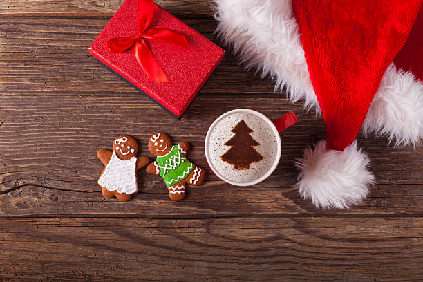 istock Christmas cappuccino and gingerbread cookies 618952736