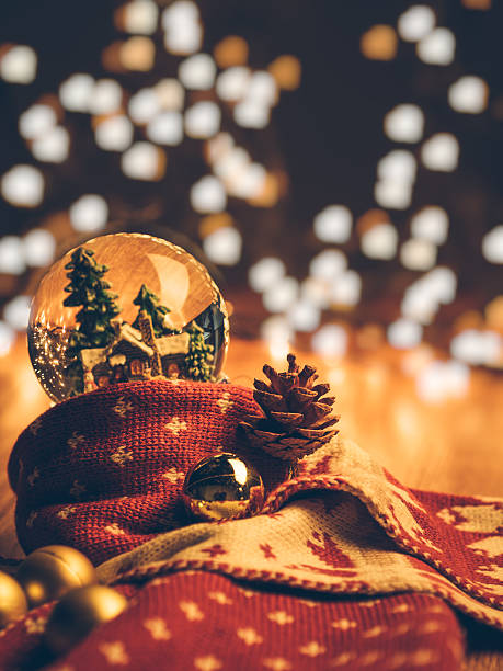 snow globe wrapped in red warm scarf