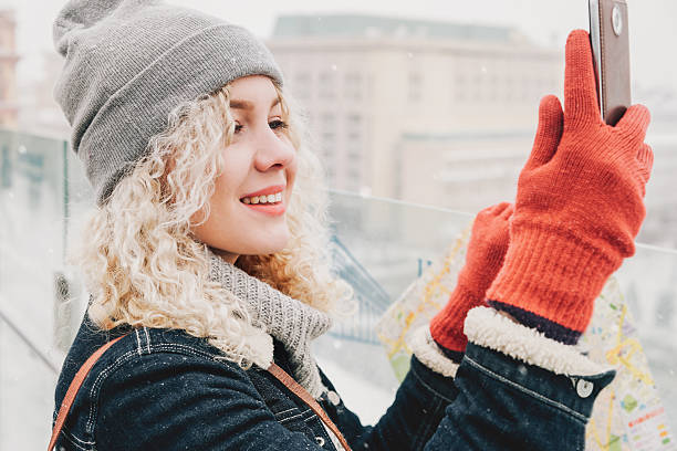 istock Curly blond girl making selfie or photo 618955090