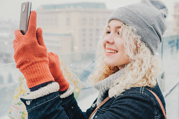 istock Curly blond girl making selfie or photo 618955118