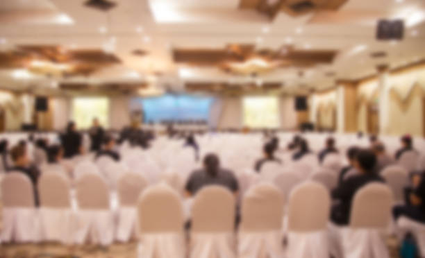 istock blurred Business Meeting. Audience in the conference hall. 618957122