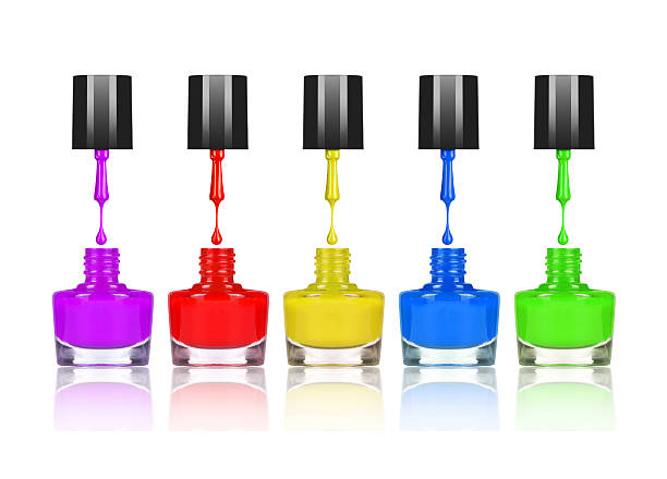 istock colorful nail polishes dripping from brush into bottle on white 618959570