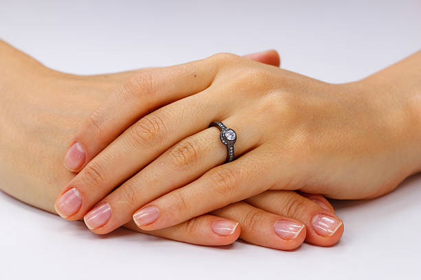 istock Close up of female hands with ring 618963056