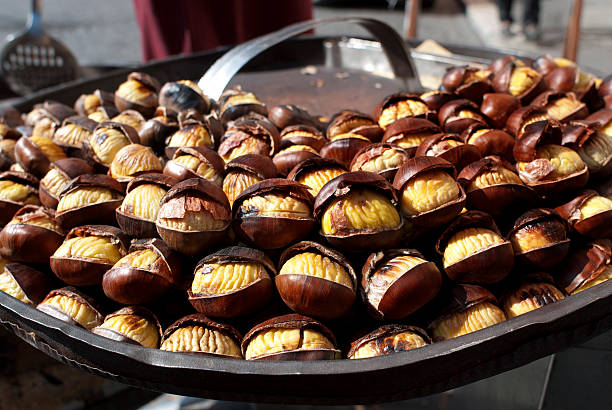 istock street food. roast chestnuts 618963596