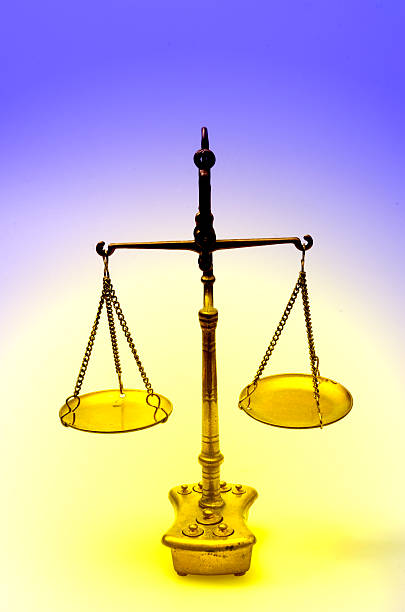 istock Golden weight scale, also  laboratory balance 618963804