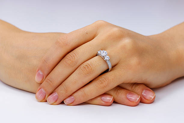 istock Close up of female hands with ring 618964896