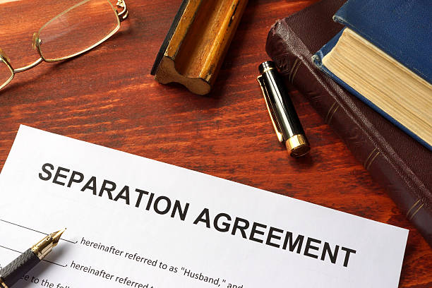 Separation agreement form on an office table. Separation agreement form on an office table. relationship difficulties stock pictures, royalty-free photos & images