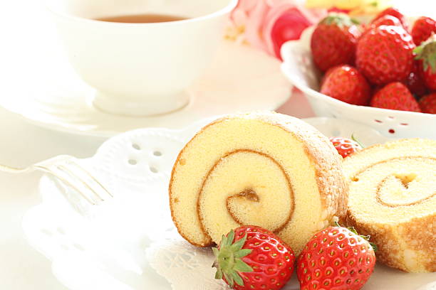 istock swiss roll cake and strawberry 618967750
