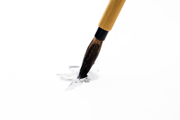 istock Chinese brushes on white paper 618968326