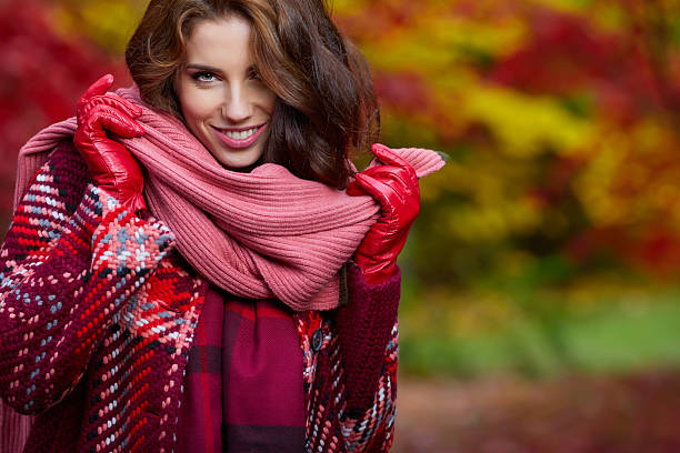 istock woman in autumn park 618969508